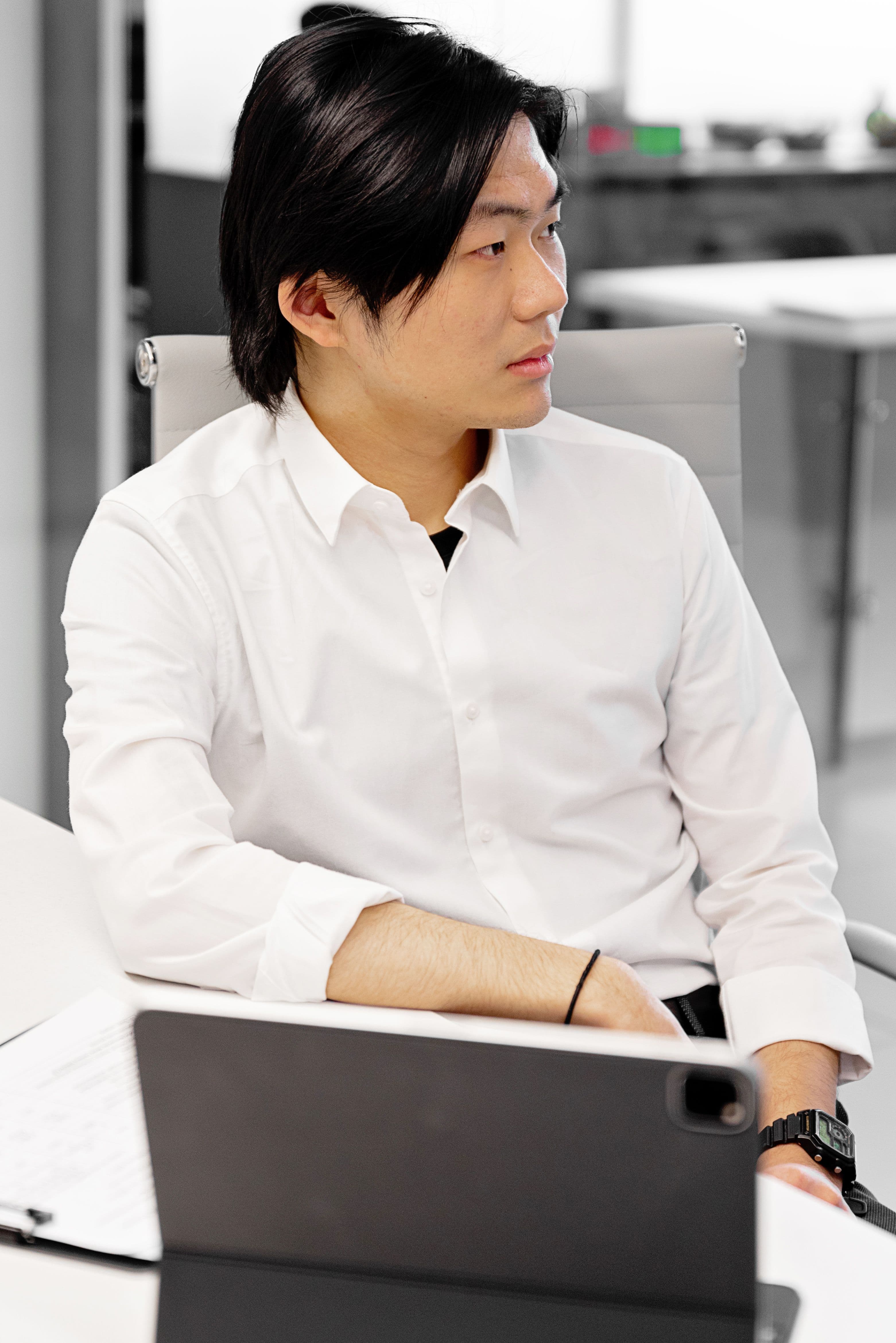 Laptop on an oak desk showing a financial analytics interface